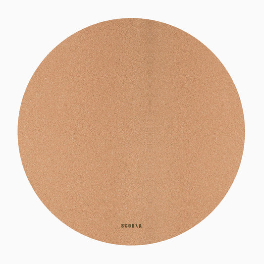 Round cork mat with branding on a white background