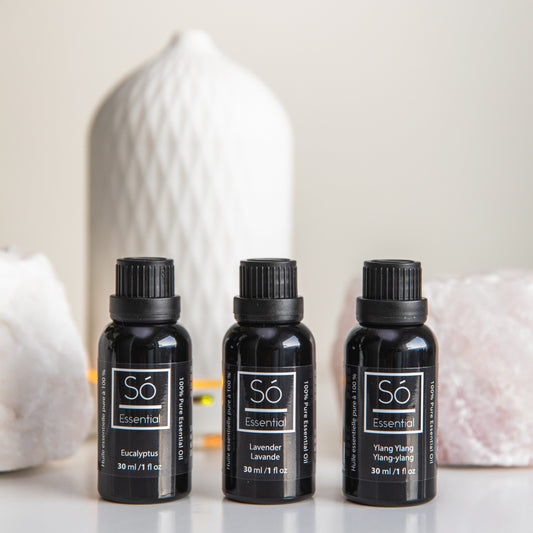 Three black essential oil bottles labeled 'Sö Essential' on a light background.
