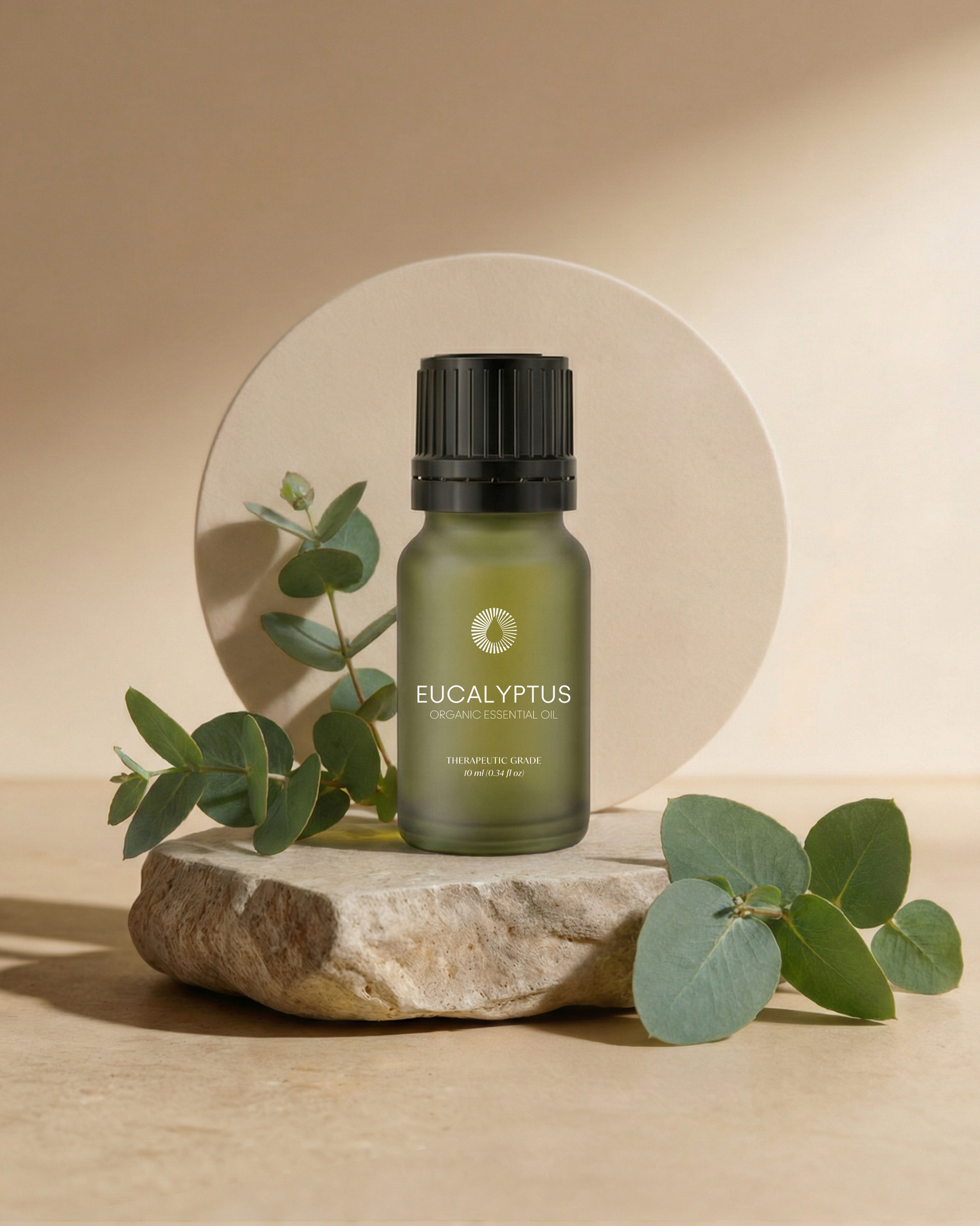 organic eucalyptus essential oil aromatherapy bottle with leaves on a stone surface
