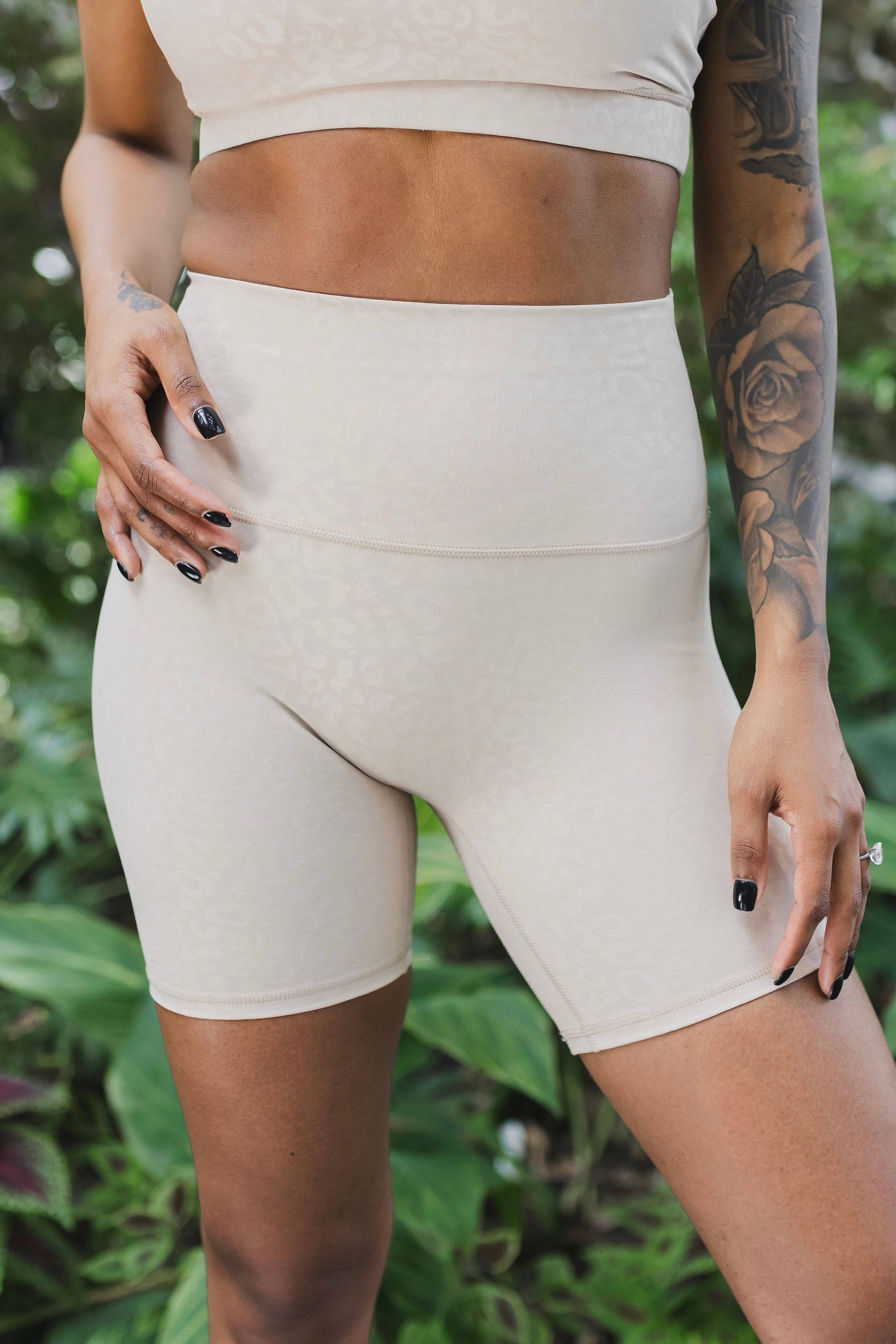front view of woman wearing barely there 6 inch shorts in ivory leopard print for yoga and activewear