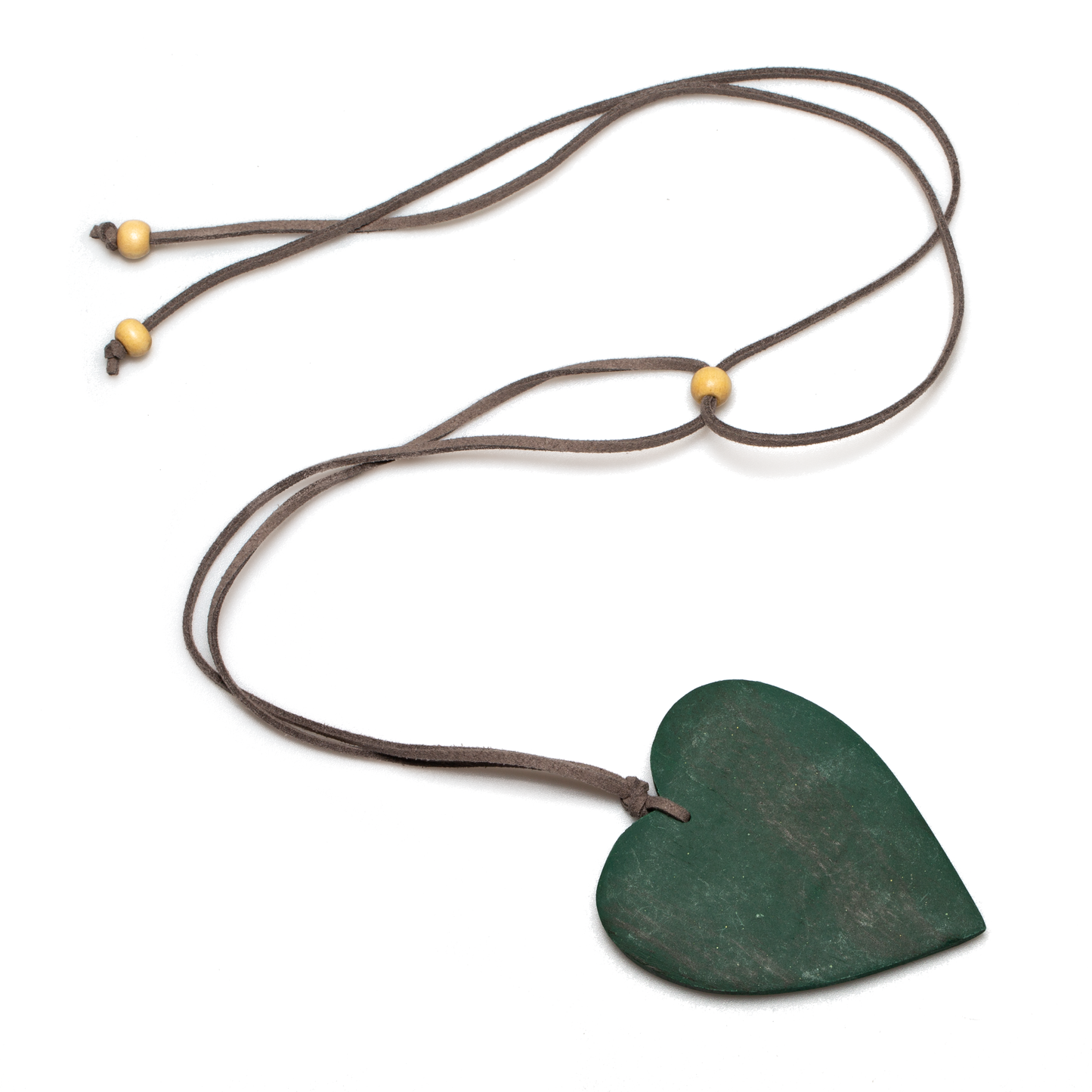 green tinted wood heart necklace — handcrafted in Bali on suede cord