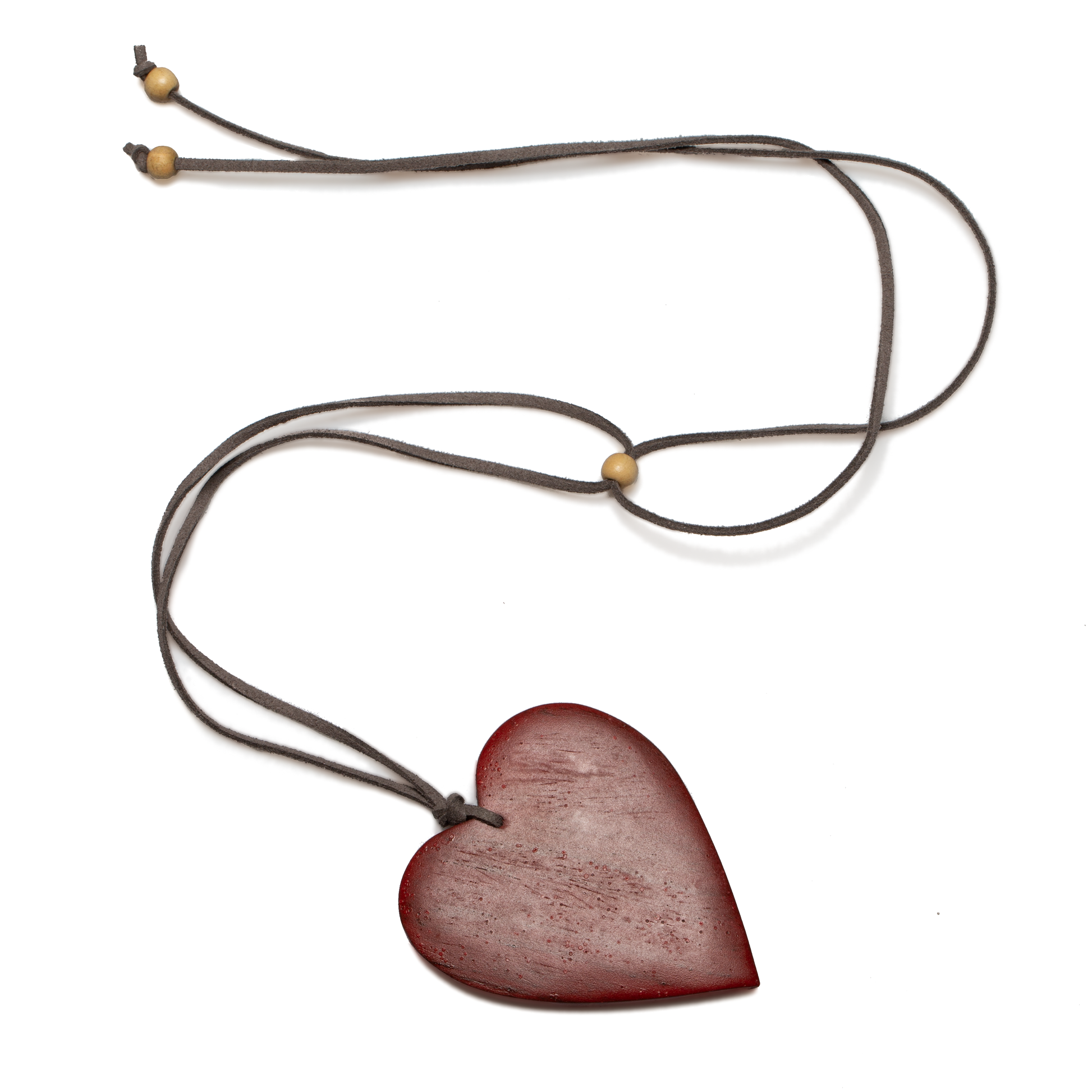 red tinted wood heart pendant necklace — bohemian jewelry handcrafted in Bali
