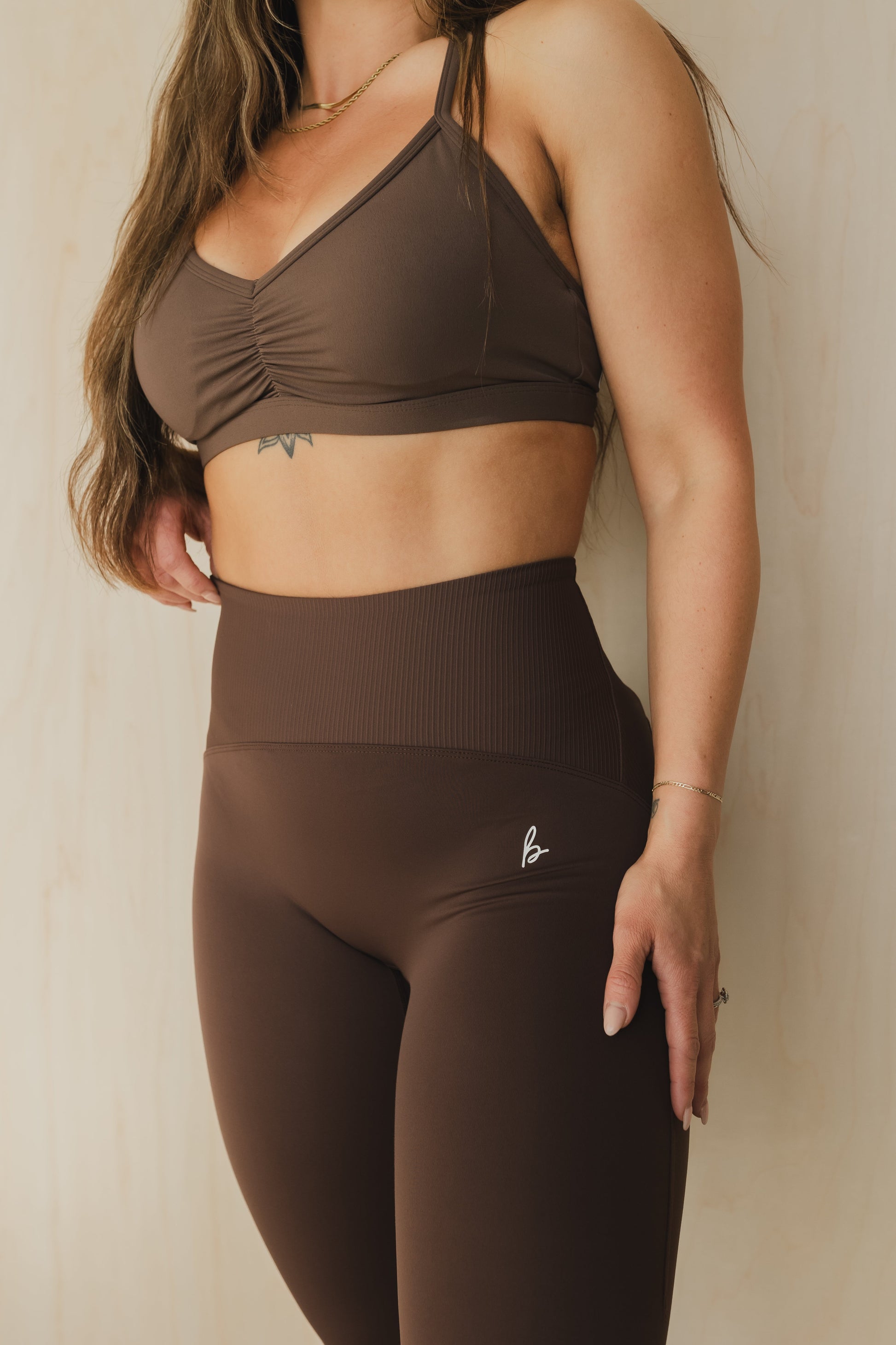 close up front view of a woman wearing 25 inch elevation leggings in french press for yoga and studio workouts