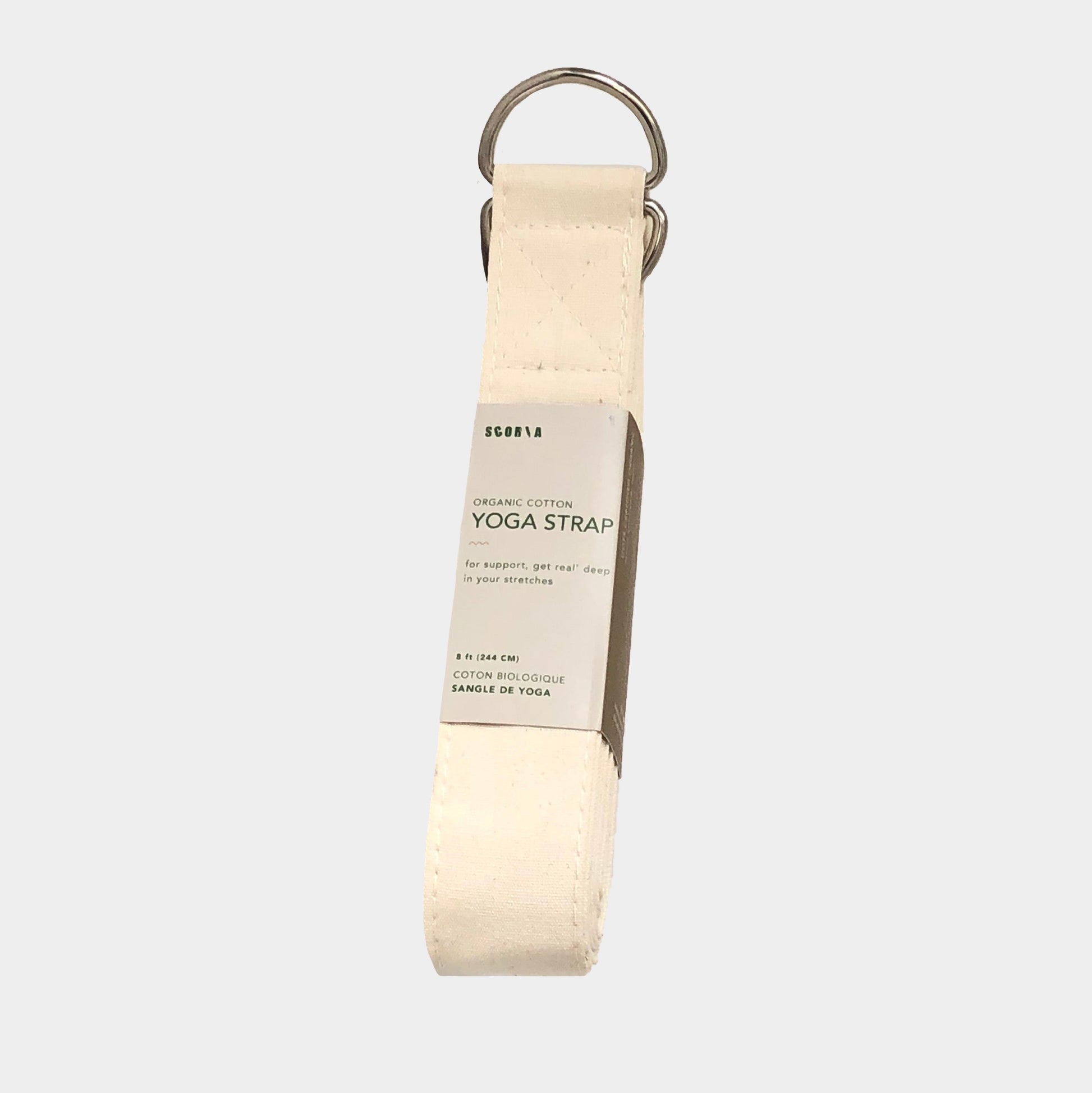 Beige yoga strap with a metal ring on a white background