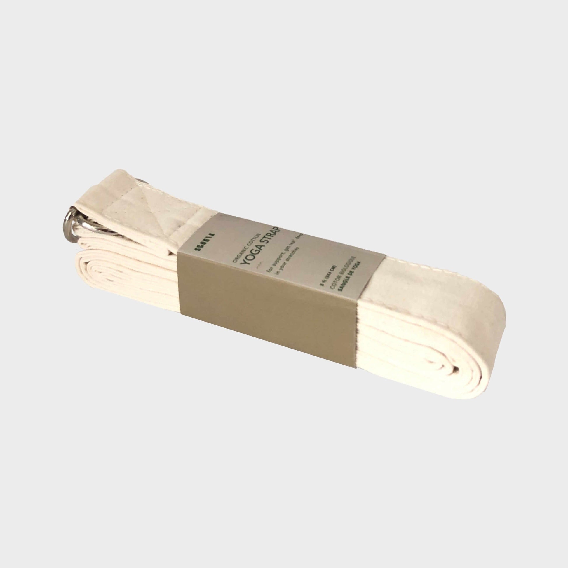 Beige yoga strap with a label on a light gray background