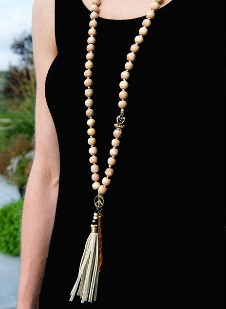Handcrafted tooth and tassel mala necklace with natural tooth pendant — ethically sourced bohemian spiritual jewelry made in India