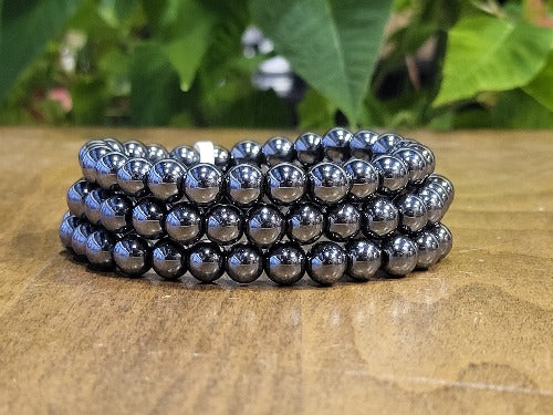 Hematite bead bracelet close-up — shiny metallic grey gemstone bracelet for women