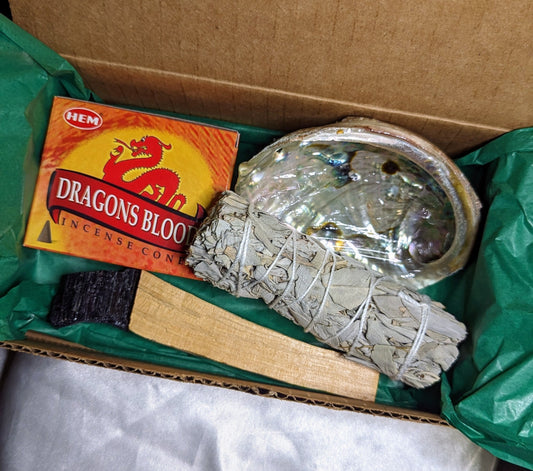 Home cleansing smudge kit with sage, crystals and palo santo for energy clearing