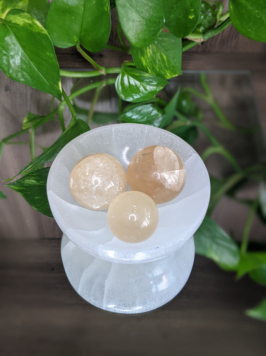 Uplifting and confidence-boosting honey calcite sphere for motivation and positive energy