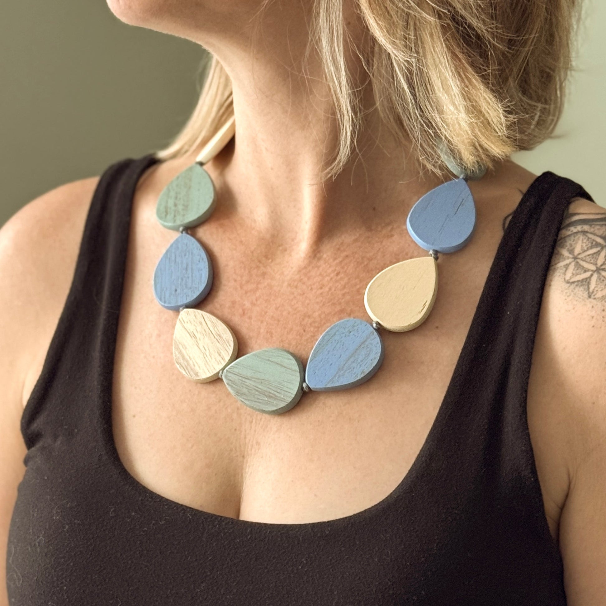 Handmade wooden pebble necklace earthy blue cream green boho style jewelry
