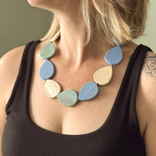 Handmade wooden pebble necklace earthy blue cream green boho style jewelry