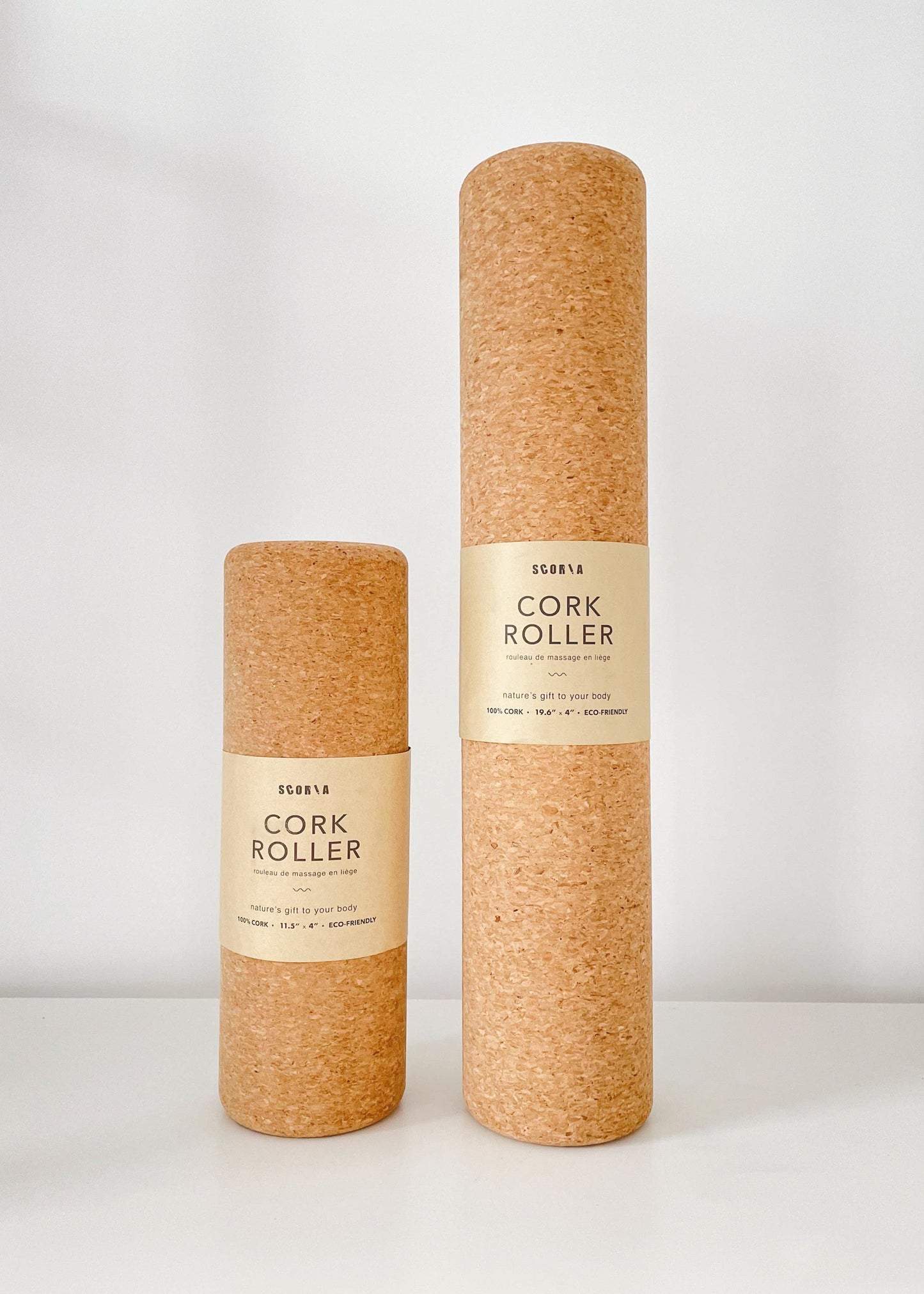 Two cork rollers with labels on a white background