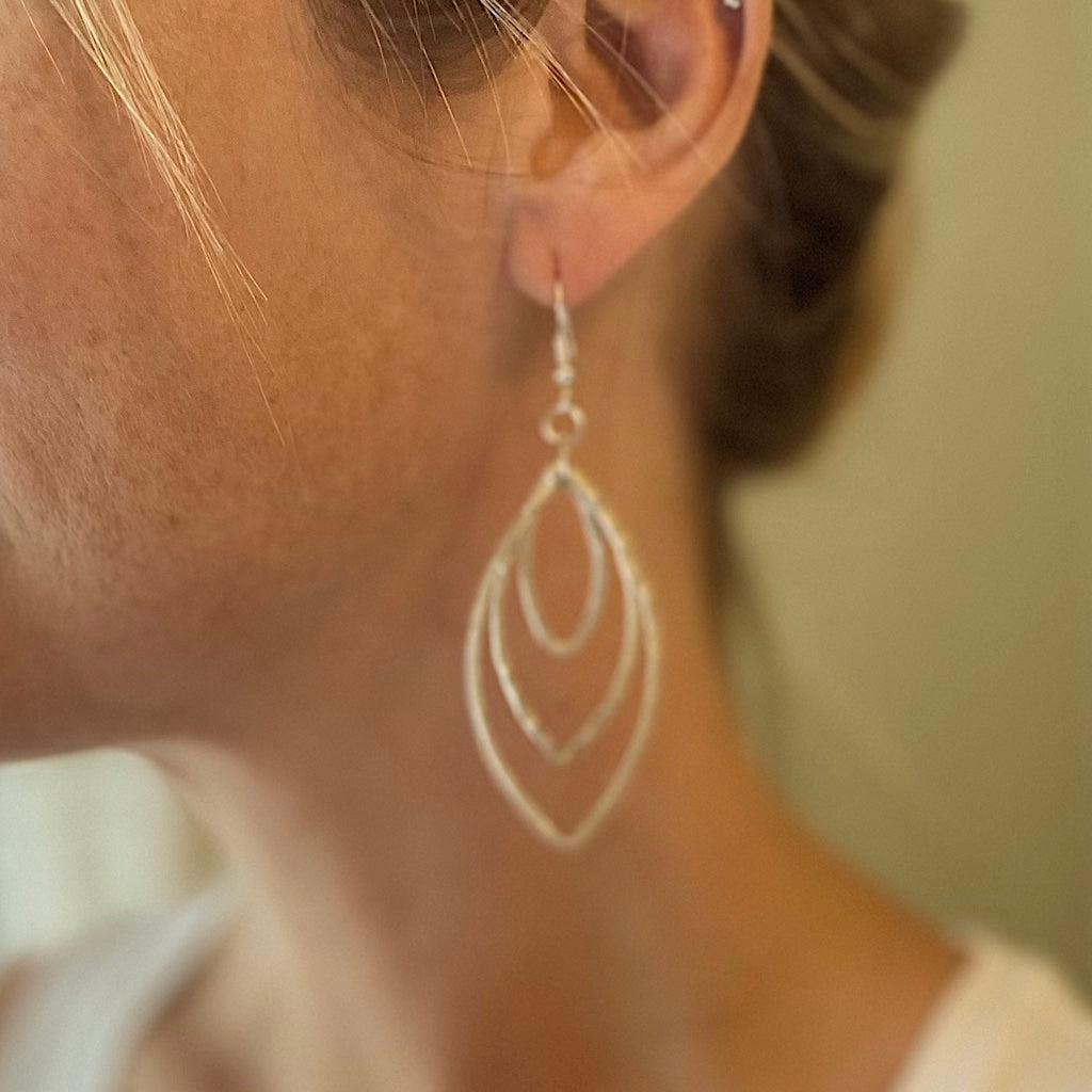 Silver plate triple oval metal drop earrings elegant dangle jewelry handmade in bali in woman's ear