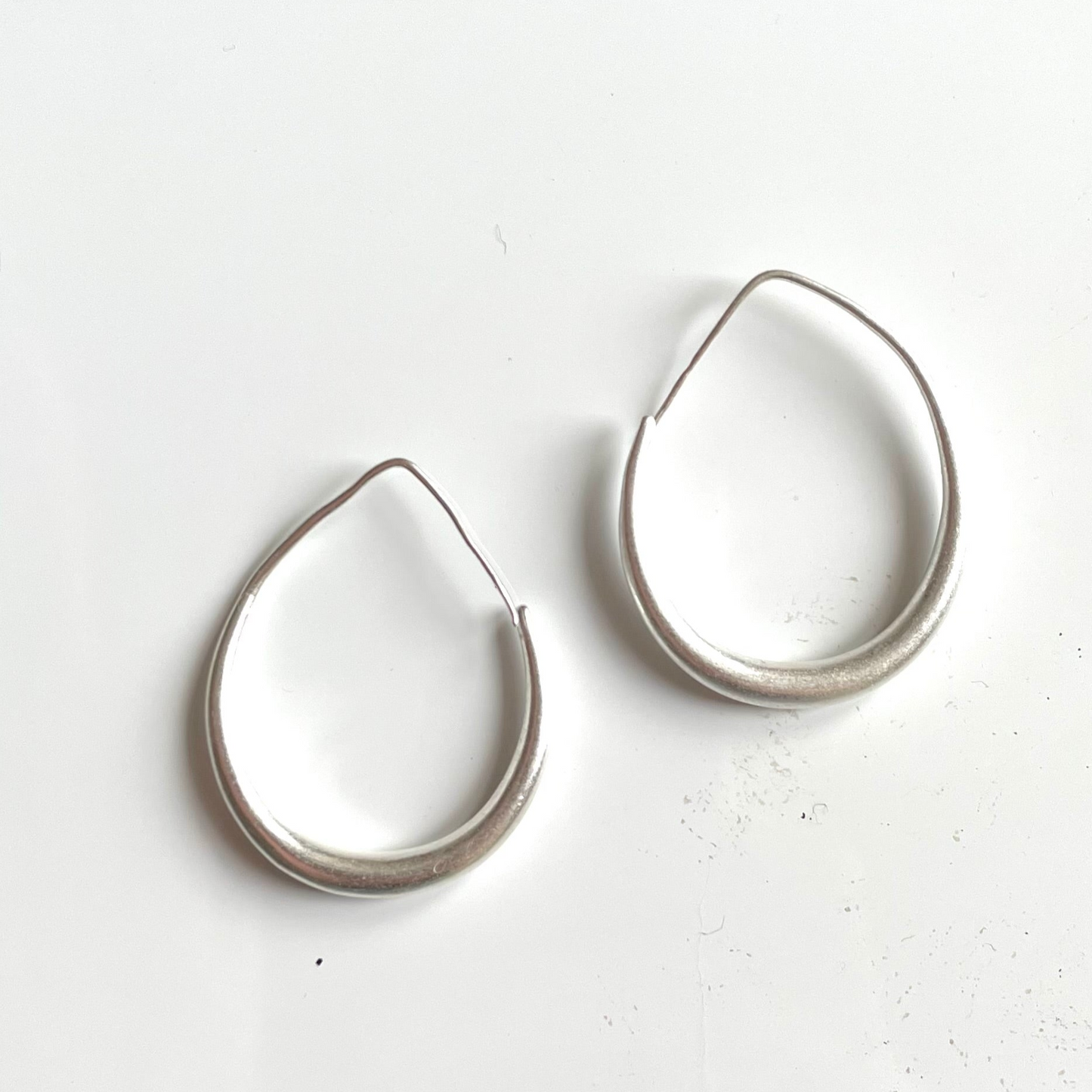 Silver plate teardrop hoop earrings elegant dangle jewelry close up