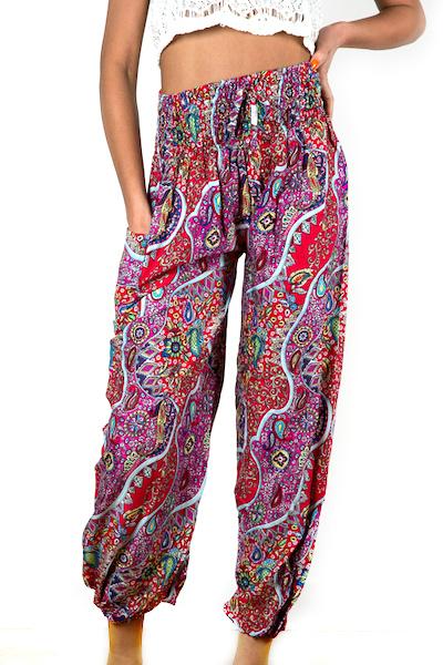 Handmade red pink paisley Bali pants fabric texture close up