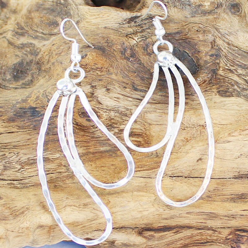 Silver double teardrop metal drop earrings handmade in Bali elegant dangle jewelry close up