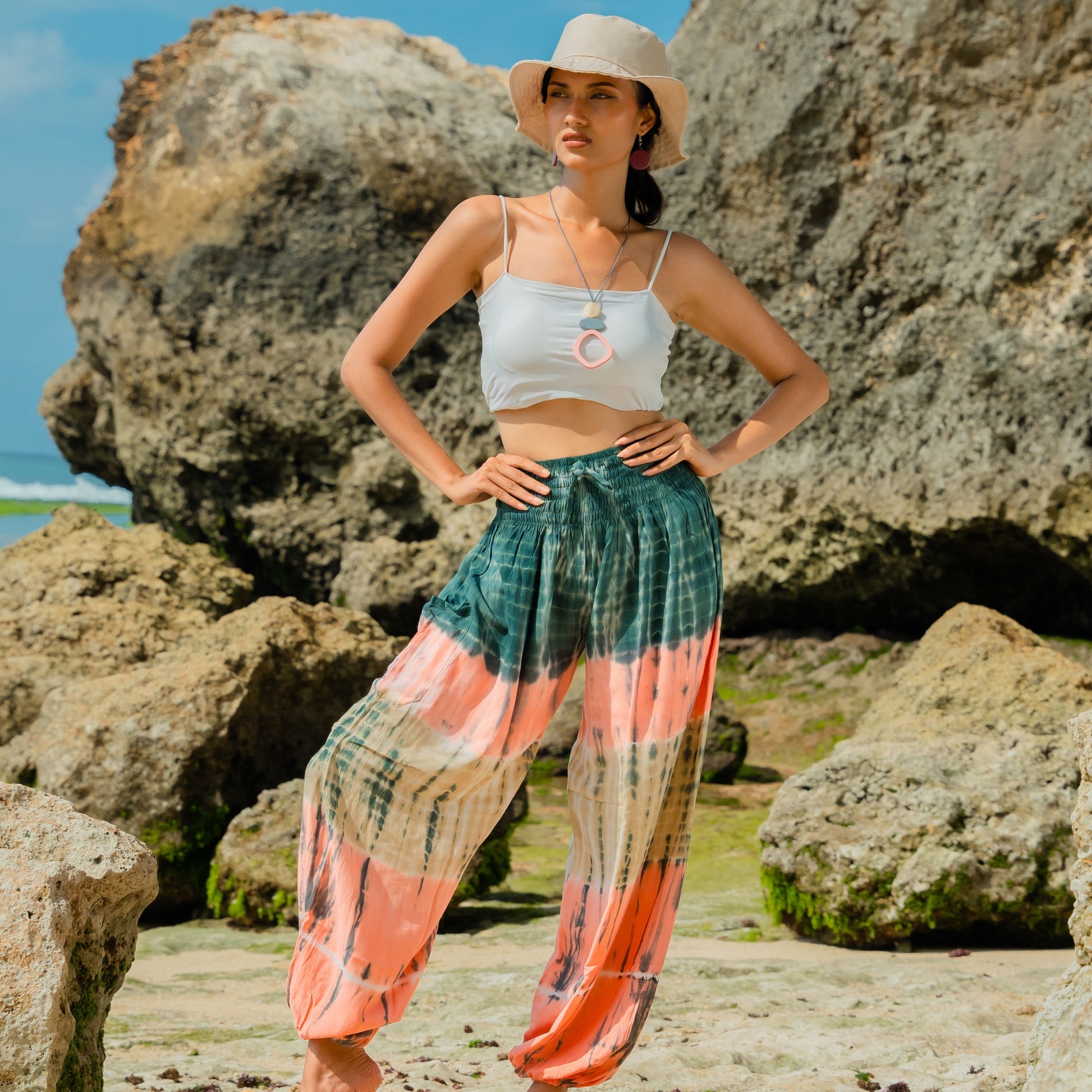 Handmade tie dye stripe Bali pants pink grey fabric texture close up