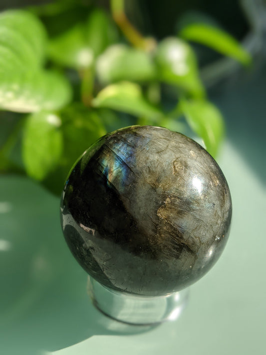 Mystical and transformation-enhancing labradorite sphere with iridescent flash