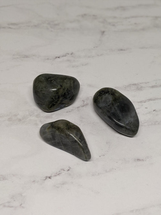 Mystical and transformation-enhancing tumbled labradorite pieces with iridescent flash