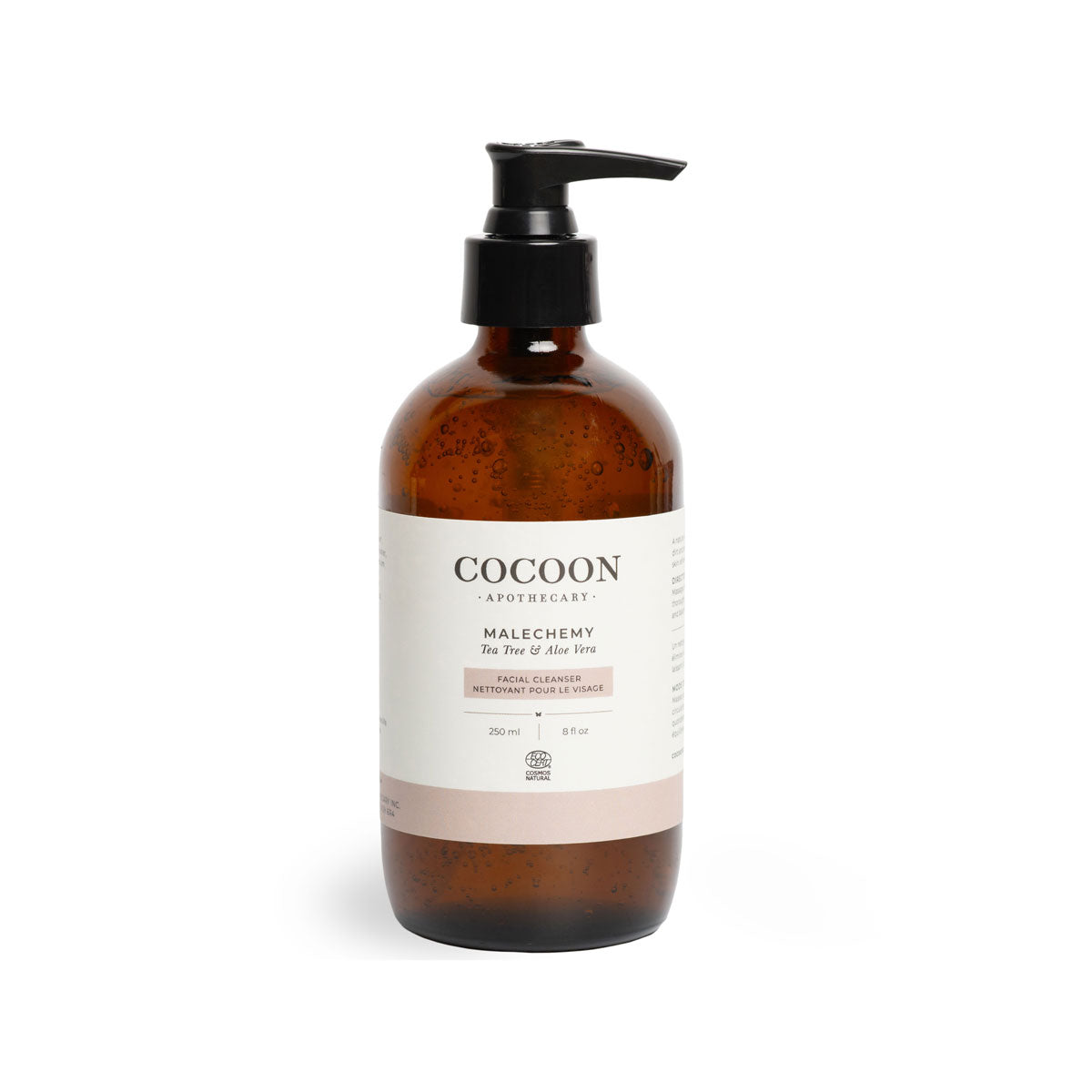 Brown bottle of facial cleanser with pump and white label on a white background