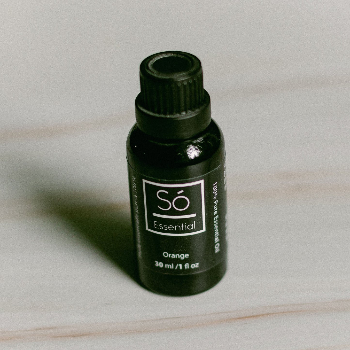 Oregano essential oil bottle labeled 'Sö Essential' on a light background