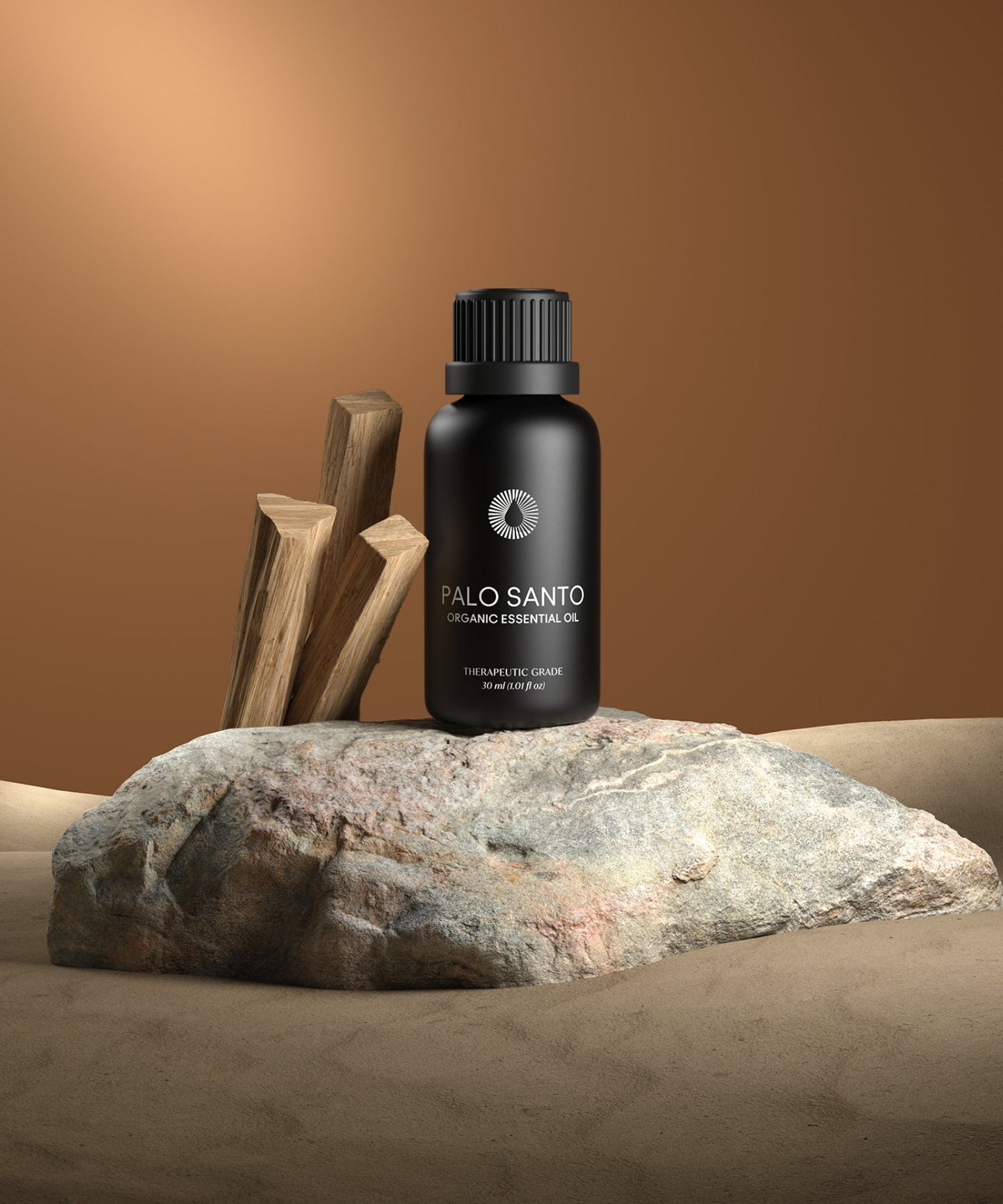 Palo Santo essential oil bottle on a rock with wooden sticks against a brown background