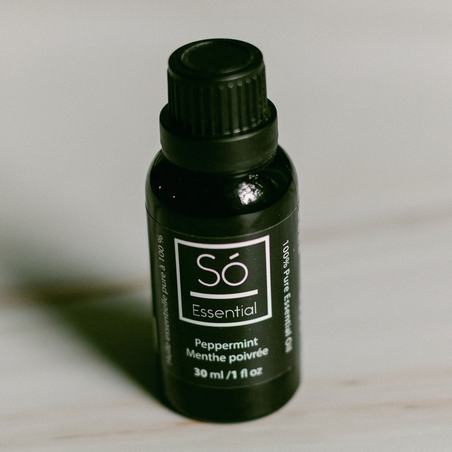 Peppermint essential oil bottle labeled 'Sö Essential' on a light background