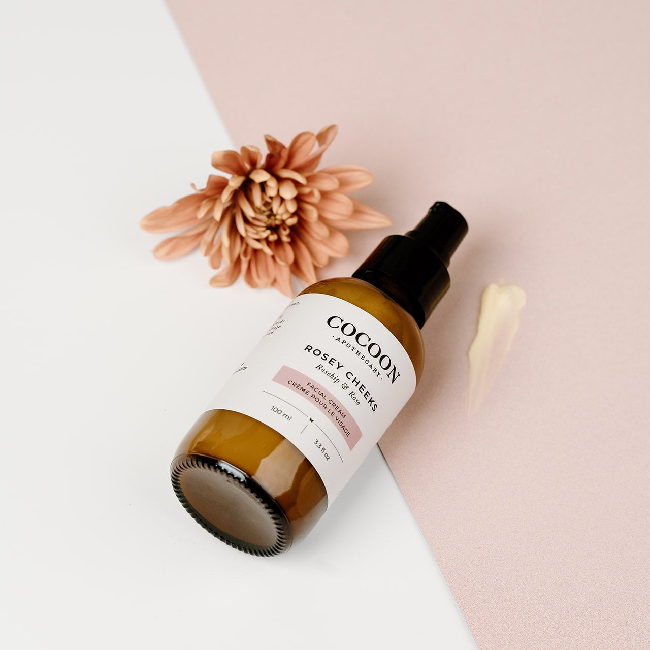 Cocoon pump bottle of Rosey Cheeks Facial Cream on a light background