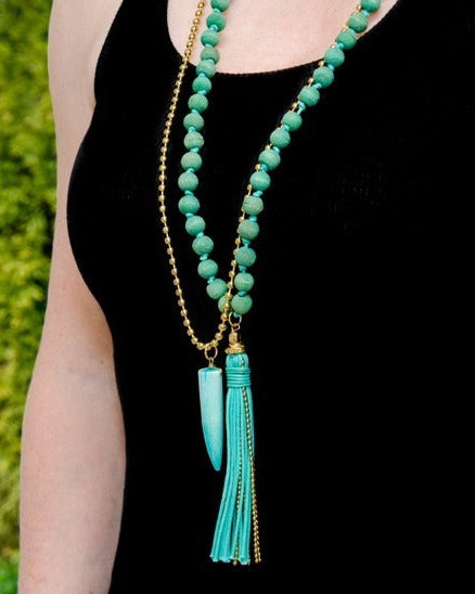 Handcrafted turquoise tooth mala necklace with natural tooth and turquoise beads — ethically sourced bohemian spiritual jewelry made in India