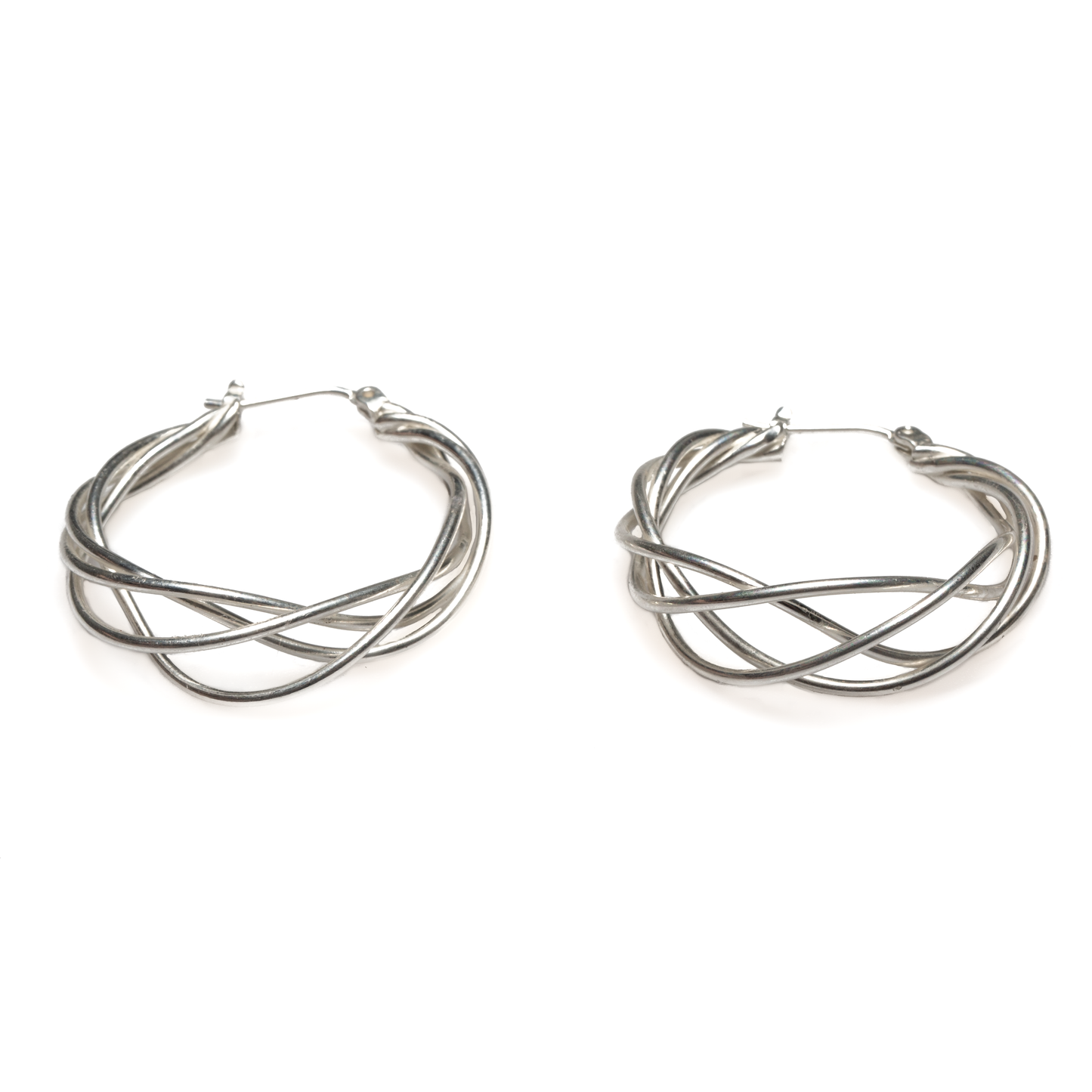 Silver plate twist drop earrings minimalist artisan jewelry on display