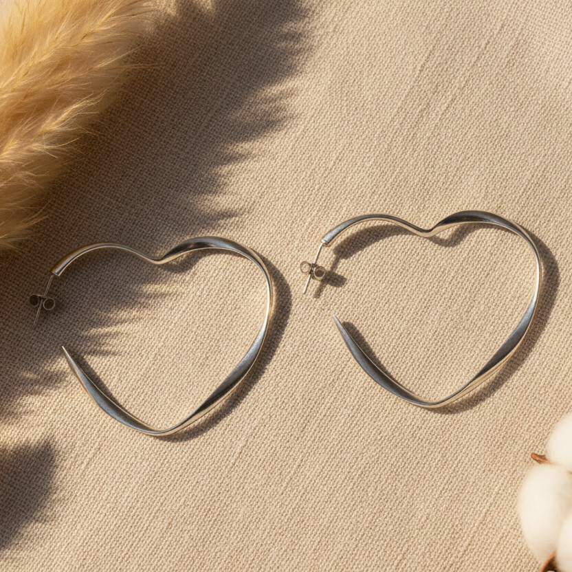 Silver plate large heart hoop earrings romantic statement jewelry handmade in Bali close up view