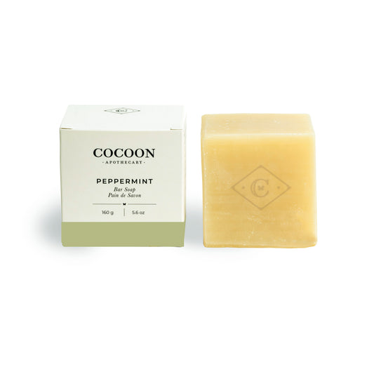 Cocoon Apothecary peppermint bar soap with packaging on a white background