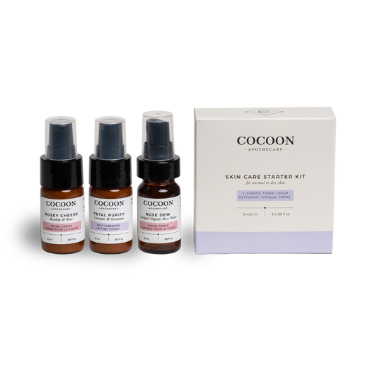 Cocoon Apothecary skin care starter kit with three bottles and a box on a white background