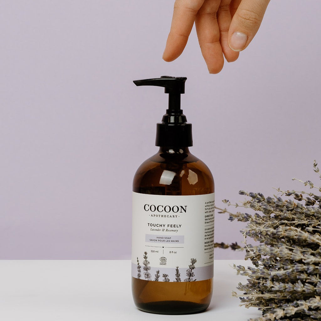 Touchy feely hand soap lifestyle shot — lemongrass and ylang ylang organic hand soap by Cocoon Apothecary