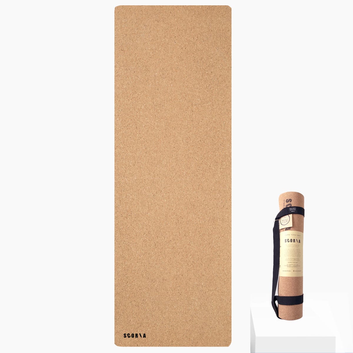 Cork yoga mat with carrying strap on a white background