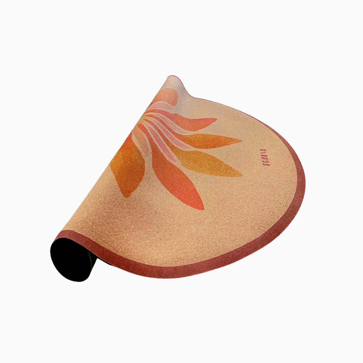 half rolled up Round cork mat with a floral design in orange and pink on a beige background