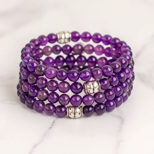 Close-up of amethyst gemstone bracelet beads — natural purple crystal bracelet handcrafted in Canada
