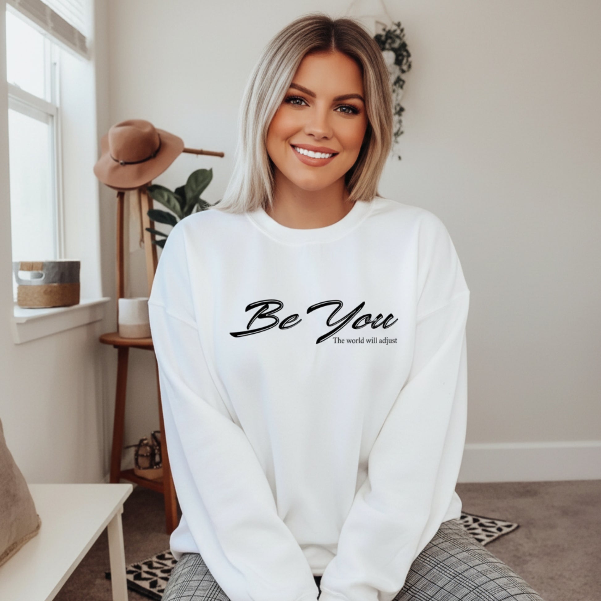 Women's Be You The World Will Adjust crewneck sweatshirt — the unapologetically authentic piece for the woman who stopped fitting in and started standing out