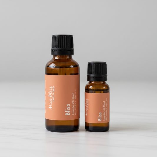 Bliss Essential Oil Blend — 30ml and 15ml amber glass bottles with orange labels, 100% pure essential oils, handcrafted in Canada