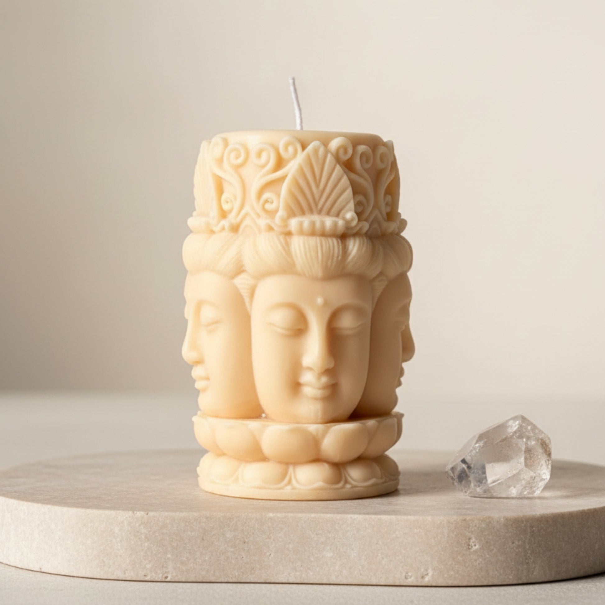Cream ivory three-face Buddha sculptural soy pillar candle with lotus base and crown detail — Estelle Studio artisan spiritual candle, meditation home décor Canada
