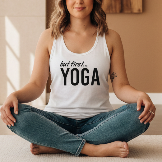 Playful "But First Yoga" racerback tank top for yoga lovers and wellness enthusiasts in white