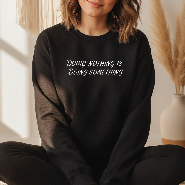 Black self-care crewneck sweatshirt with Doing Nothing Is Doing Something HTV print — women's mindfulness gift, sizes S–2XL