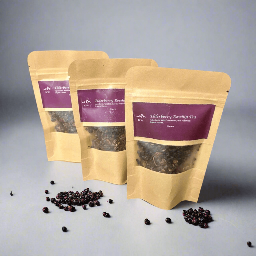 Three brown paper tea bags with purple labels on a gray background