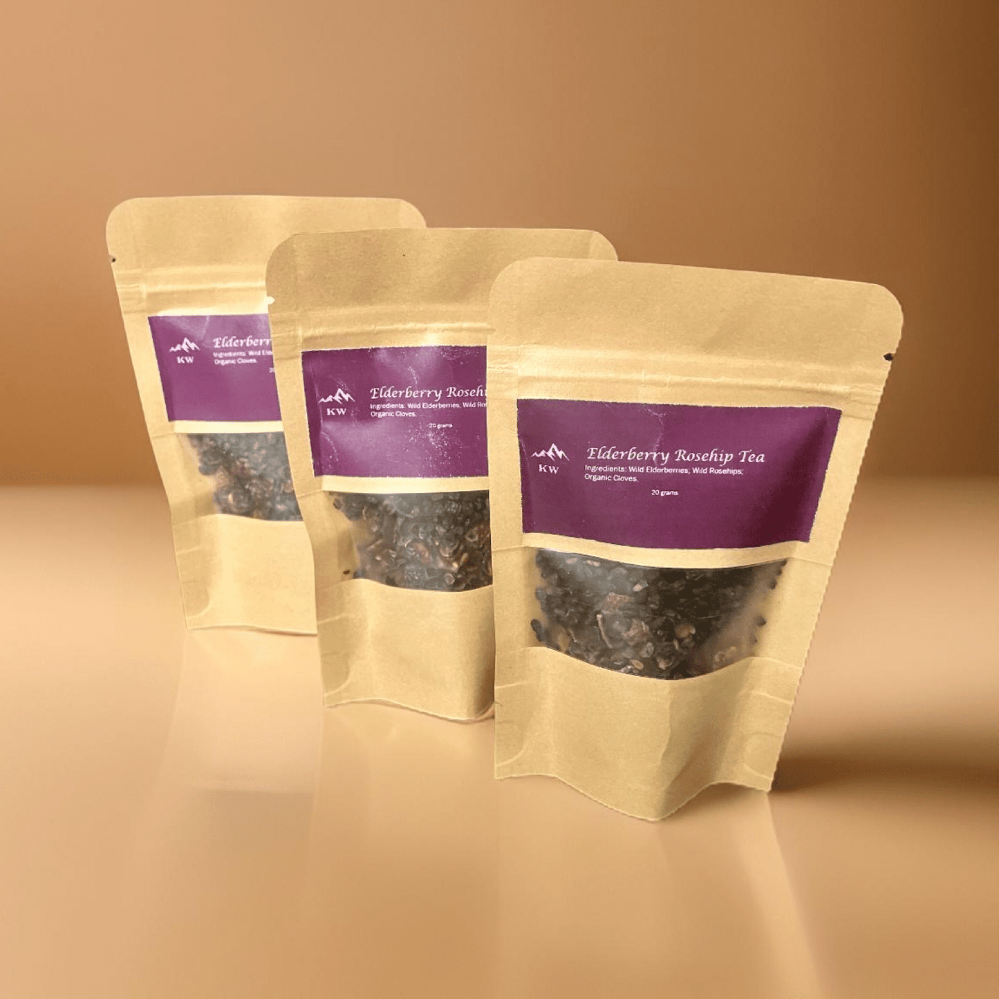 Three packages of Tiberberry Rooibos Tea on a beige background