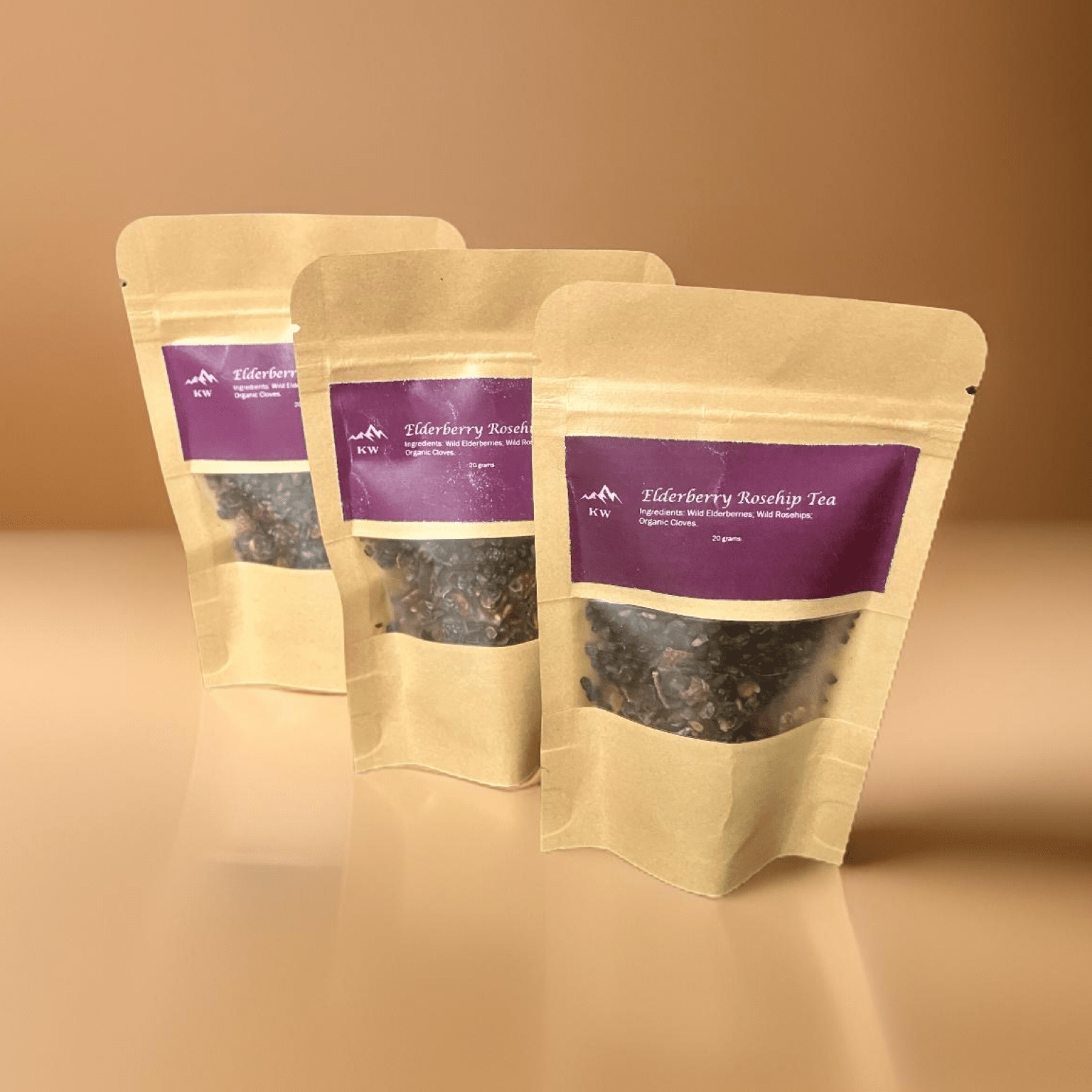 Three packages of Tiberberry Rooibos Tea on a beige background