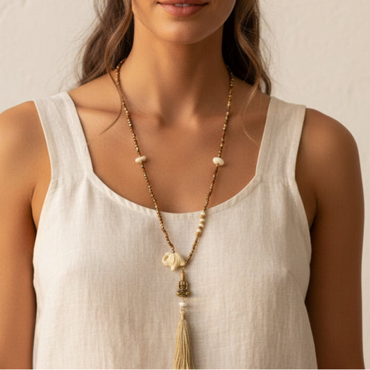 Elephant and tassel mala necklace worn by a woman — handmade in India with natural beads and elephant pendant for boho, yoga, and spiritual style