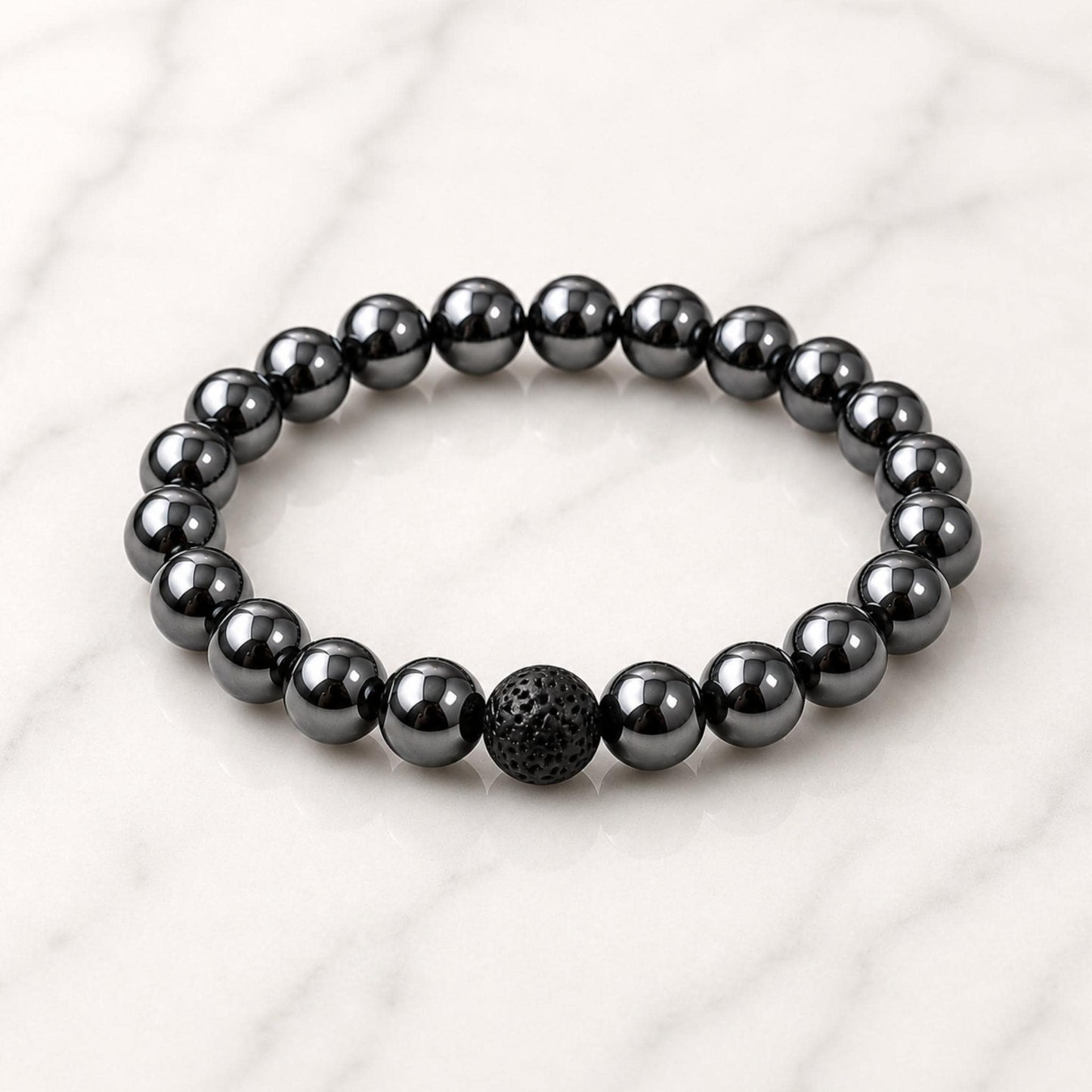 Hematite diffuser bracelet close-up — genuine crystal chips with porous lava stone beads for essential oils
