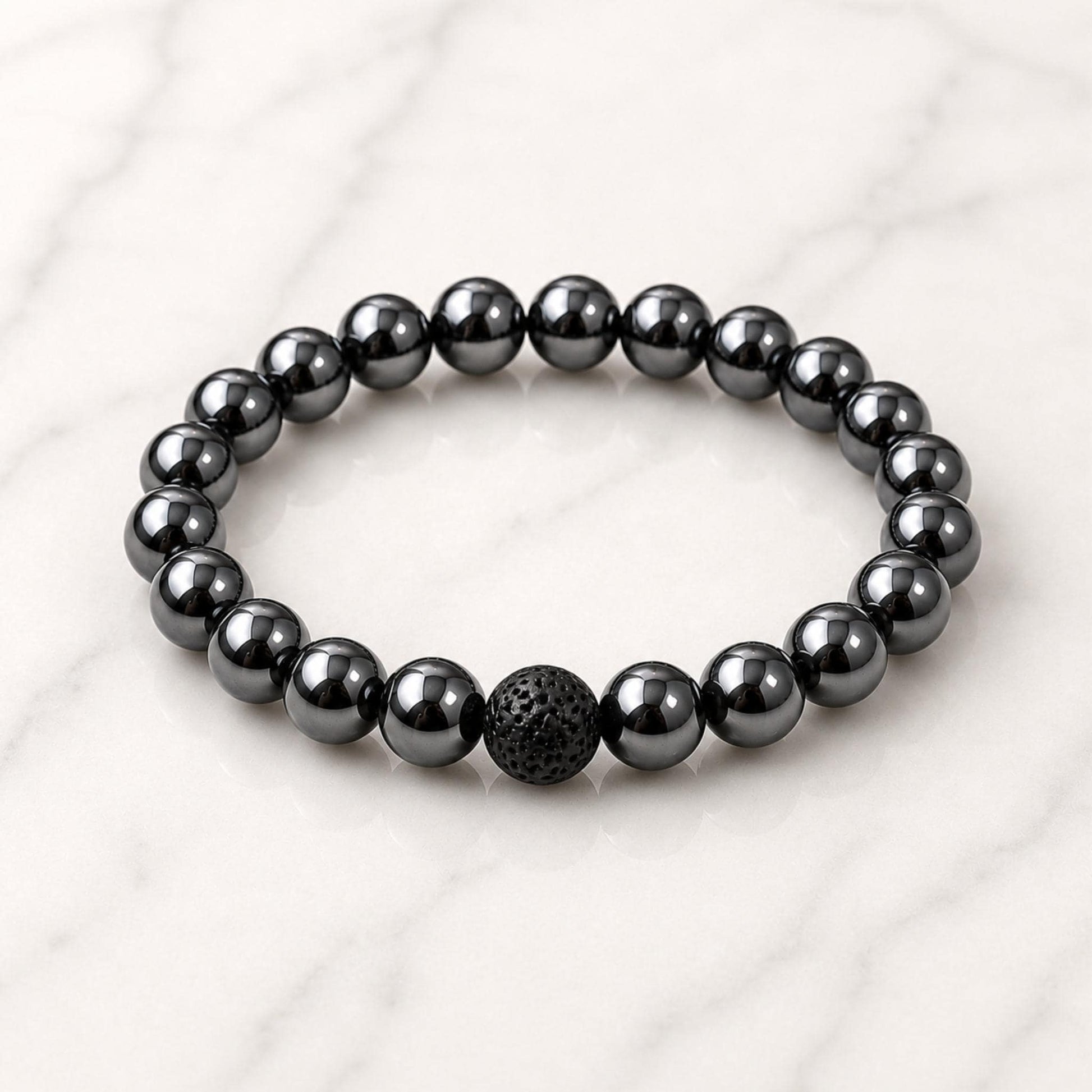 Hematite diffuser bracelet close-up — genuine crystal chips with porous lava stone beads for essential oils