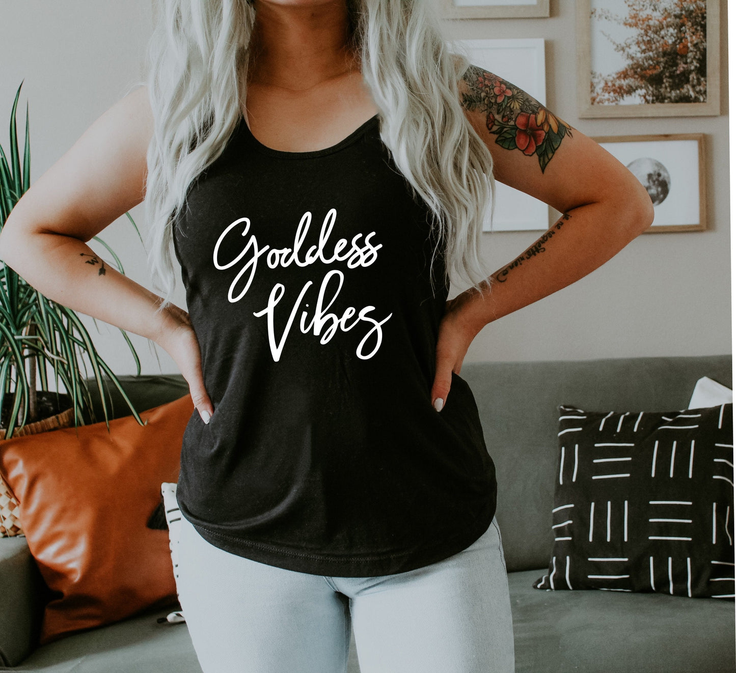 Women's empowerment racerback tank with bold "Goddess Vibes" graphic print in black