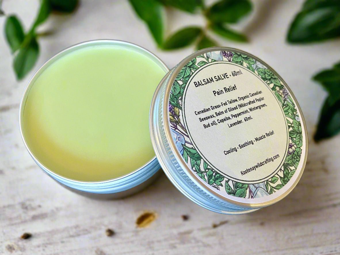 Balm salve in a tin with a label on a wooden surface with leaves in the background